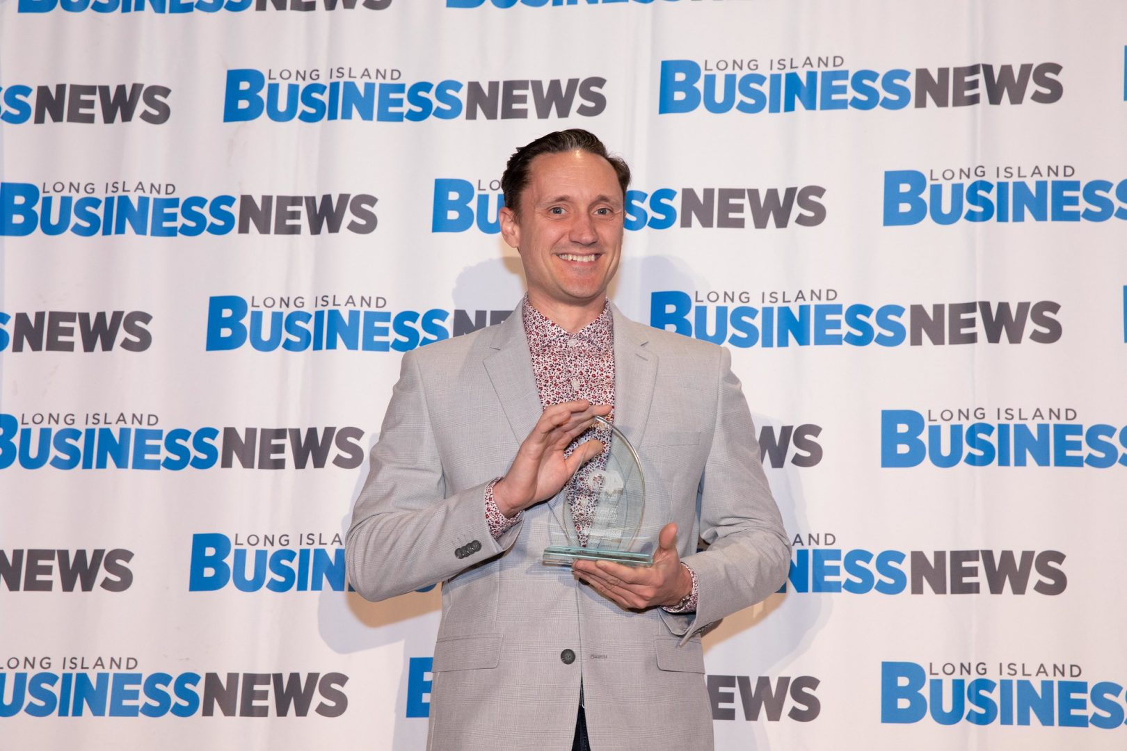 JR Jensen accepts 40 Under 40 Award